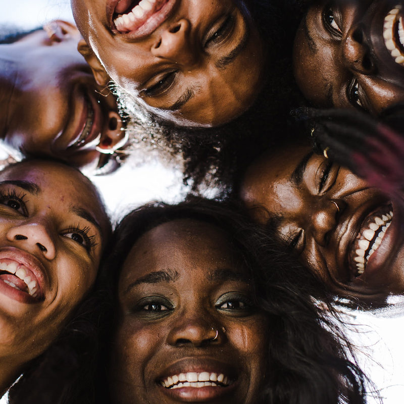 A group of Black women laughing together
